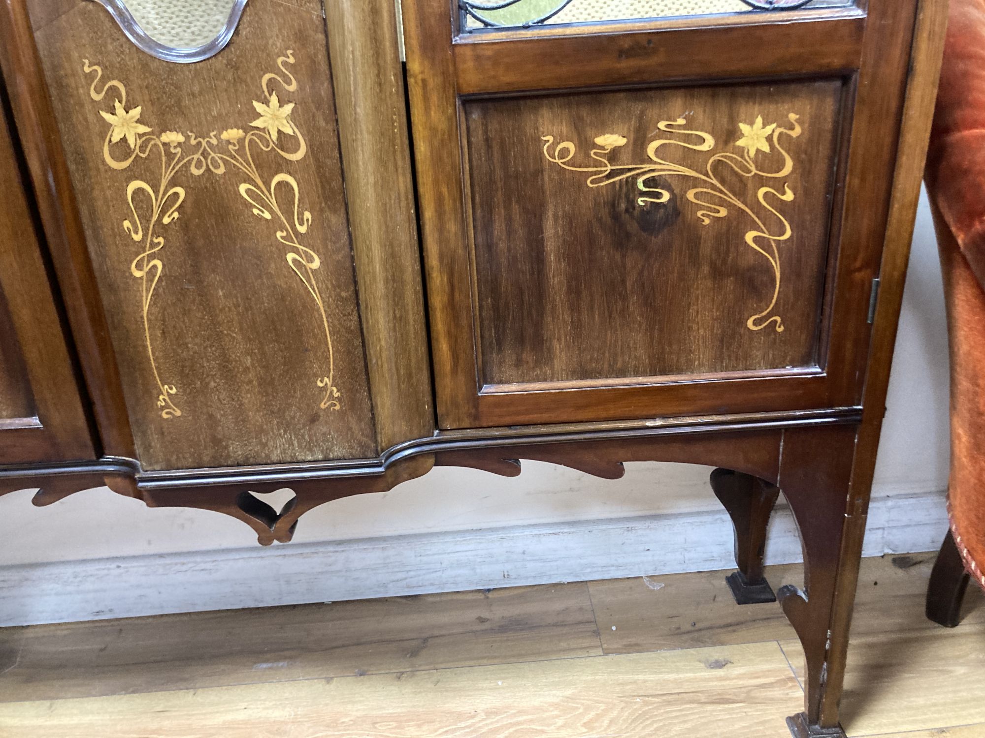 An Edwardian Art Nouveau marquetry inlaid mahogany display cabinet,